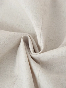 Detailed close-up of textured cotton linen fabric on a sleeveless round-neck top