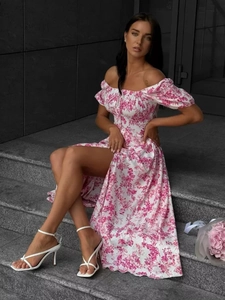 Detailed view of the puff sleeves and floral pattern on the off-shoulder split dress