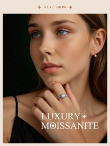Elegant model wearing 1-carat moissanite ring and stud earrings in sterling silver