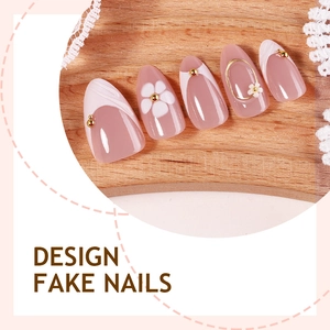 Short almond press-on nails in nude pink with white flowers and gold metallic accents