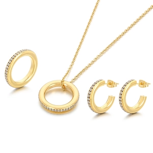 Polished gold jewelry set with round crystal pendant necklace, ring and earrings