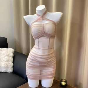 Elegant nude pink mesh bodycon dress with halter neckline and floral detail on bust