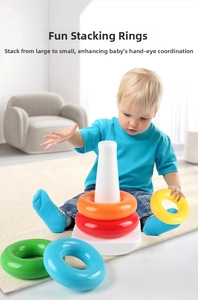Detail of toddler playing with colorful rainbow stacking rings on a white base for early learning