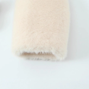 Women's minimalist faux fur coat in cream white with soft lamb wool texture detail