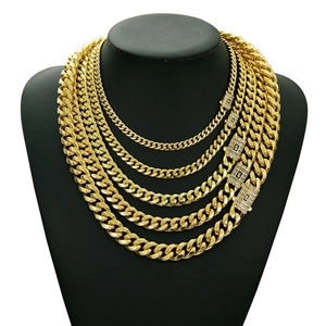 14K gold plated stainless steel Cuban link necklaces stacked on black bust display