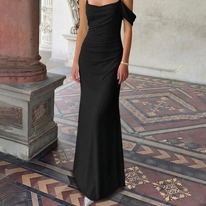 Detail of elegant black satin long dress with side ruching and backless design