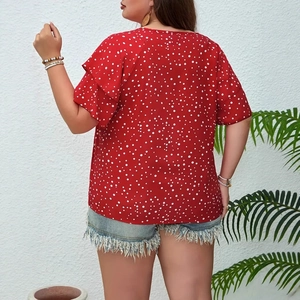 Back view of plus size red polka dot top with layered ruffle sleeves for summer