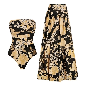Bandeau floral one-piece swimsuit paired with a matching high-waisted tiered maxi skirt set