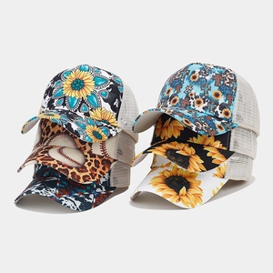 Various printed mesh trucker hats with sunflower, leopard, and western patterns for women