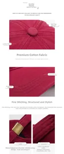 Detail of burgundy cotton baseball cap with metal buckle and reinforced stitching
