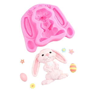 Pink silicone Easter bunny mold with textured rabbit fondant for baking decorations