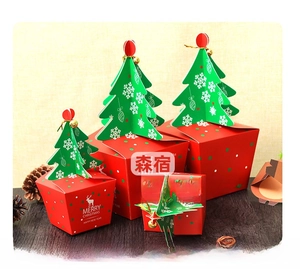 Christmas gift box set with green 3D tree lids and white reindeer on festive red card
