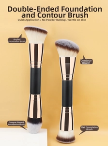 Dual-ended foundation brushes with flat and angled bristles on a decorative stone base