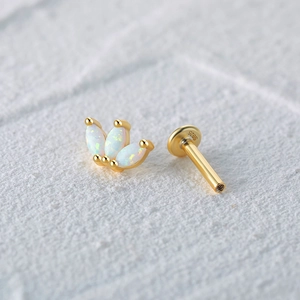 Macro detail of S925 sterling silver opal piercing stud with leaf design and threaded post