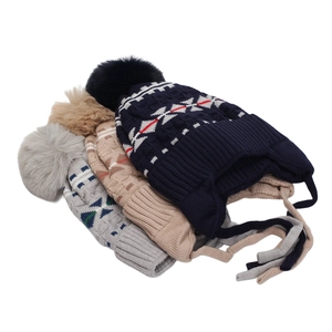 Three-piece set of boys winter knit earflap hats with geometric patterns and pom poms