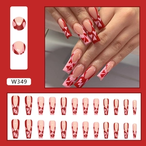 Red heart French press-on nails set with long coffin shape and color contrast detail