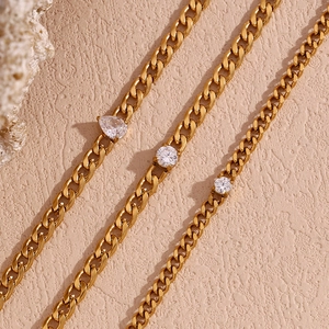 Detail of 18K gold plated Cuban chain with marquise and round cubic zirconia stones