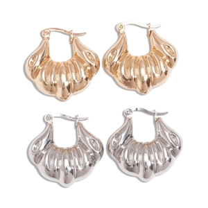 Minimalist geometric croissant hoop earrings in gold and silver with ribbed texture