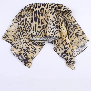 Women's leopard print scarf in mustard and brown featuring lightweight silk chiffon fabric