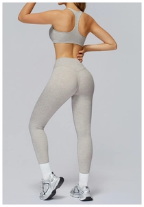 Detail of light gray brushed yoga set showing racerback sports bra and high-waist leggings