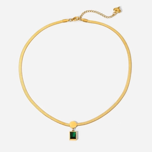 Detailed view of the 18K gold snake chain necklace with a green rectangular gemstone