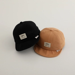 Cotton baseball caps for toddlers featuring soft brim and letter patch in black and camel