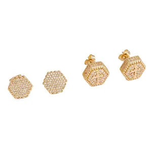 Golden hexagonal stud earrings set with sparkling zircon pavé and cross relief details