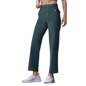 Detail view of dark blue straight leg cropped jeans with waist buckle and white sneakers