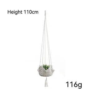 Detail view of 110cm handmade cotton macrame plant hanger with rustic tassels and knots