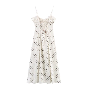 Sleeveless polka dot midi dress with spaghetti straps and lace-up back design
