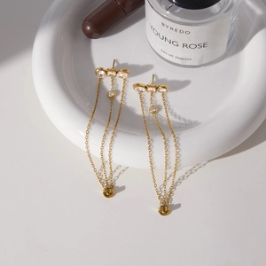 Elegant gold stainless steel tassel earrings with zircon stones in luxury gift tray