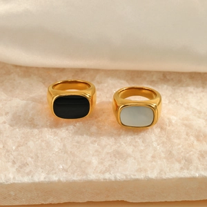 Gold plated stainless steel rings with black and white shell inlays on stone and silk