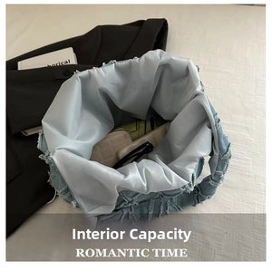 Detailed interior of the blue denim quilted tote bag showing its spacious capacity