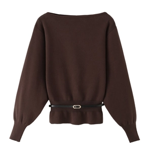 Detail of dark brown knit sweater featuring elegant boat neck and thin black waist belt