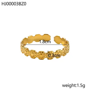 Detail showing gold floral adjustable ring dimensions with 1.8cm diameter and 0.3cm width
