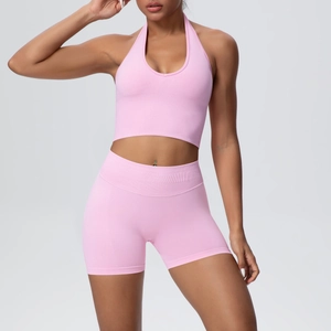 Close-up of pink seamless knitted halter-neck sports bra and high-waist shorts set