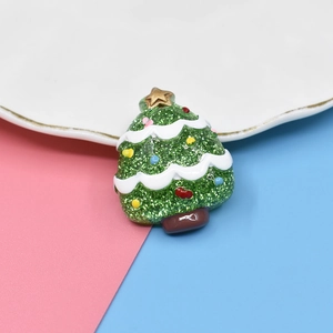 Sparkly green resin Christmas tree charm with colorful dots and gold star for DIY crafts