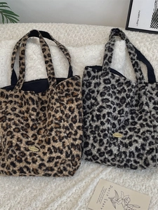 Stylish faux shearling leopard print tote bag with soft texture and metallic logo detail