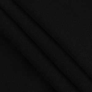 Close-up of black fine texture fabric showing weave detail and drape of the V-neck dress