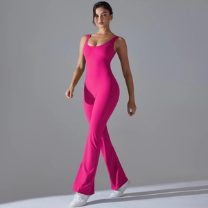 Detailed back view of hot pink flared leg sports jumpsuit with high-waist yoga fit