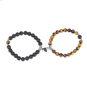 Couples beaded bracelets with black matte stone and tiger eye stone featuring heart magnet