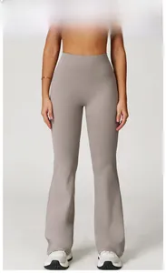 Detail view of high-waisted taupe yoga flare pants showing slimming fit and fabric texture