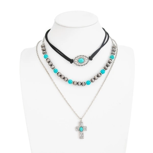 Detailed layered bohemian necklace featuring blue turquoise beads and a silver cross pendant