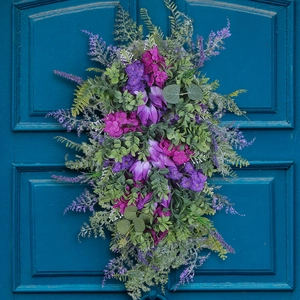 Purple tulip wreath with hydrangea on vintage blue door for elegant home spring decoration