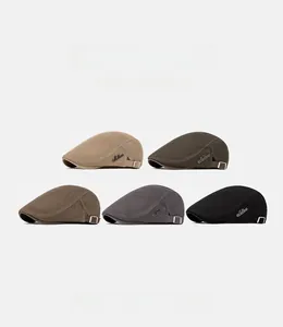 Detail view of five mesh ivy caps in various colors with adjustable metal side buckles