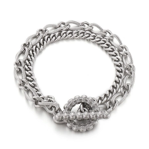 Silver titanium steel double-layer chain bracelet with skull toggle clasp on white background