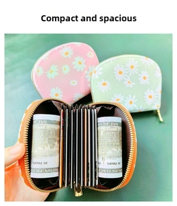 Detail of accordion card slots and daisy print on small floral zipper coin purses