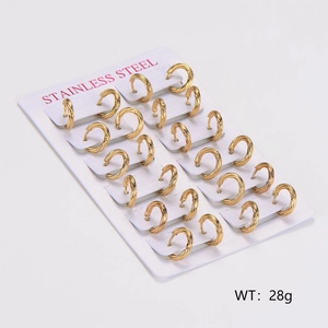 Detail of 12 pairs of gold twisted stainless steel cable earrings on a display card