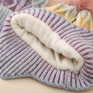 Fleece lined winter cable knit pom hat for kids featuring colorful tie-dye gradient patterns