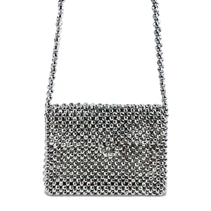 Detailed view of handcrafted silver beaded crossbody bag with glossy metallic finish